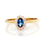 Złoty pierścionek 375 z niebieskim akwamarynem i cyrkoniami