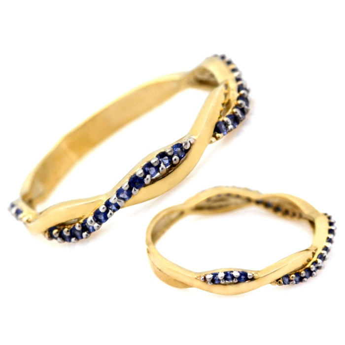 Złoty delikatny pierścionek 333 przeplatany z niebieskimi cyrkoniami