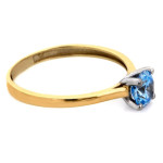 Pierścionek złoty zaręczynowy 375 z niebieskim oczkiem