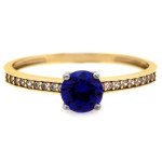 Złoty pierścionek 375 zaręczynowy z niebieskim oczkiem