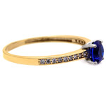 Złoty pierścionek 375 zaręczynowy z niebieskim oczkiem