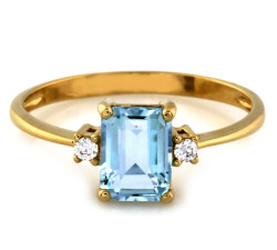 Złoty pierścionek 585 z niebieskim topazem jubilerskim