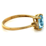 Złoty pierścionek 585 z prostokątnym niebieskim topazem jubilerskim