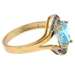 Złoty pierścionek 585 z niebieskim topazem syntetycznym i cyrkoniami