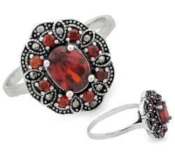 Srebrny pierścień owalny z markazytami i czerwonymi kamieniami 