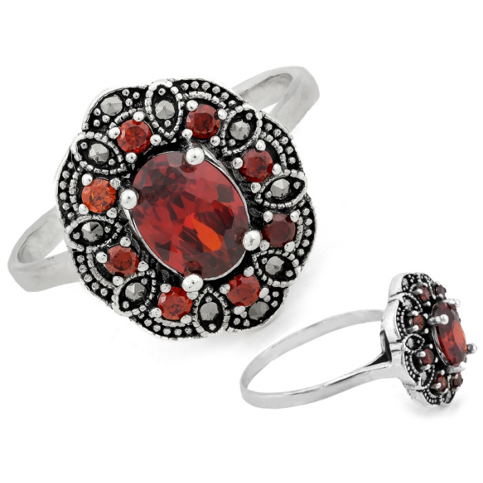 Srebrny pierścień owalny z markazytami i czerwonymi kamieniami 