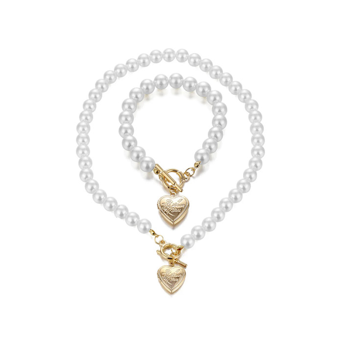 Komplet biżuterii perełkowy bransoletka i naszyjnik z zawieszką serce puzderko
