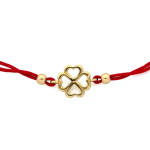 Złota bransoletka 585 na czerwonym sznurku z ażurową koniczynką
